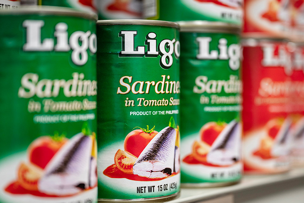 Canned sardines in tomato sauce fill some shelf space at Filipino Market.
